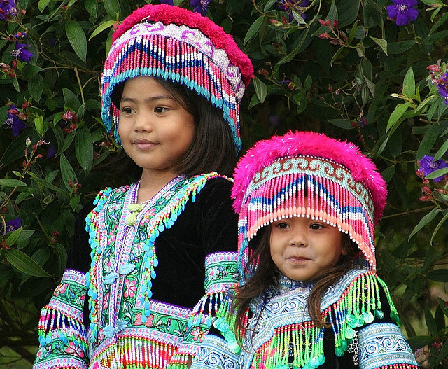 Little sisters in hilltribe costumes in Chiang Mai, Thailand